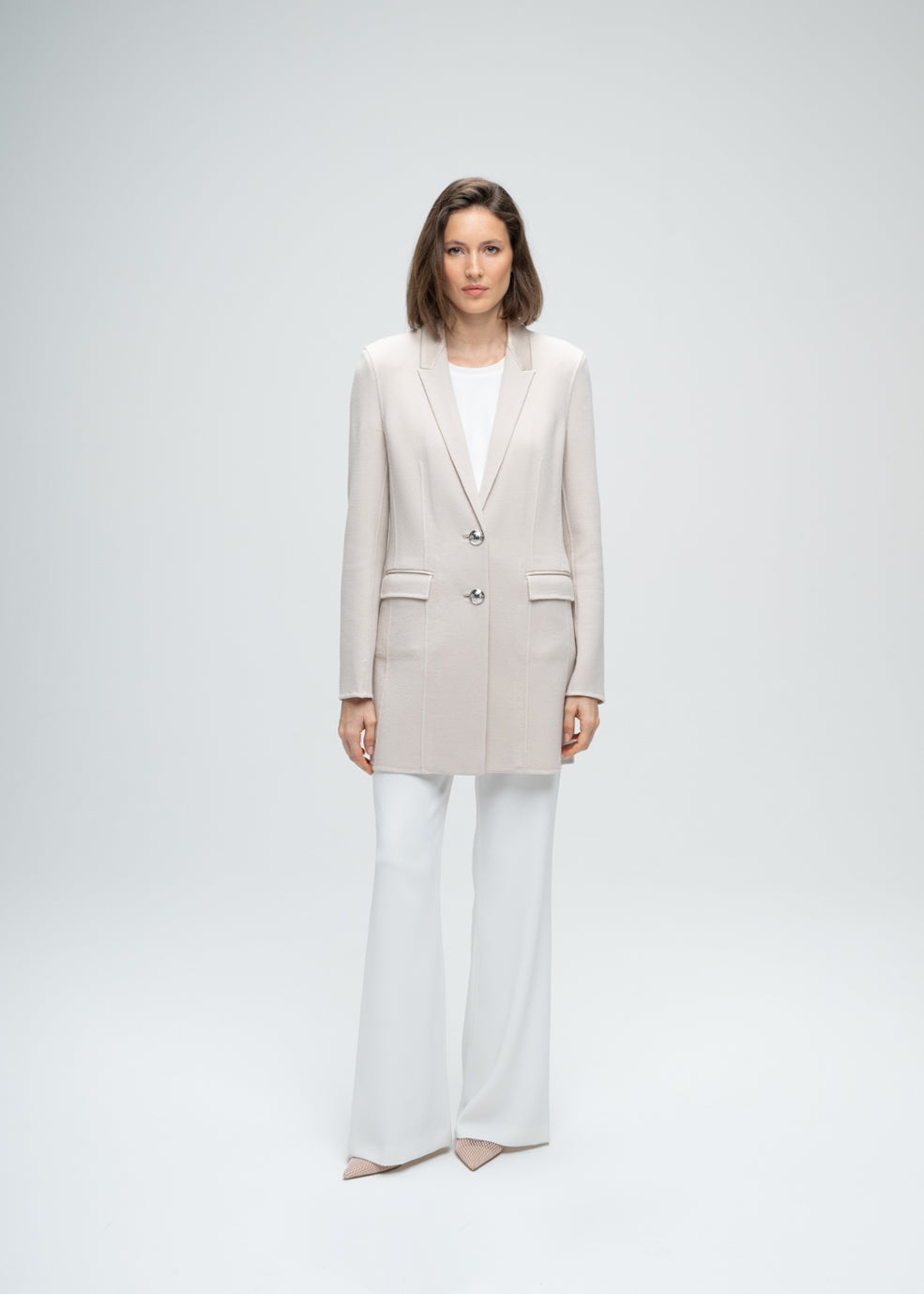 Blazer long en laine beige double boutonnière poches passepoiles en cuir