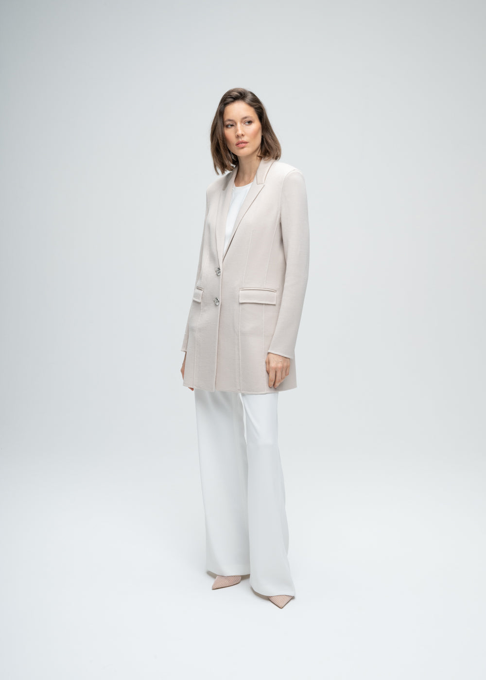 Blazer long en laine beige double boutonnière poches passepoiles en cuir