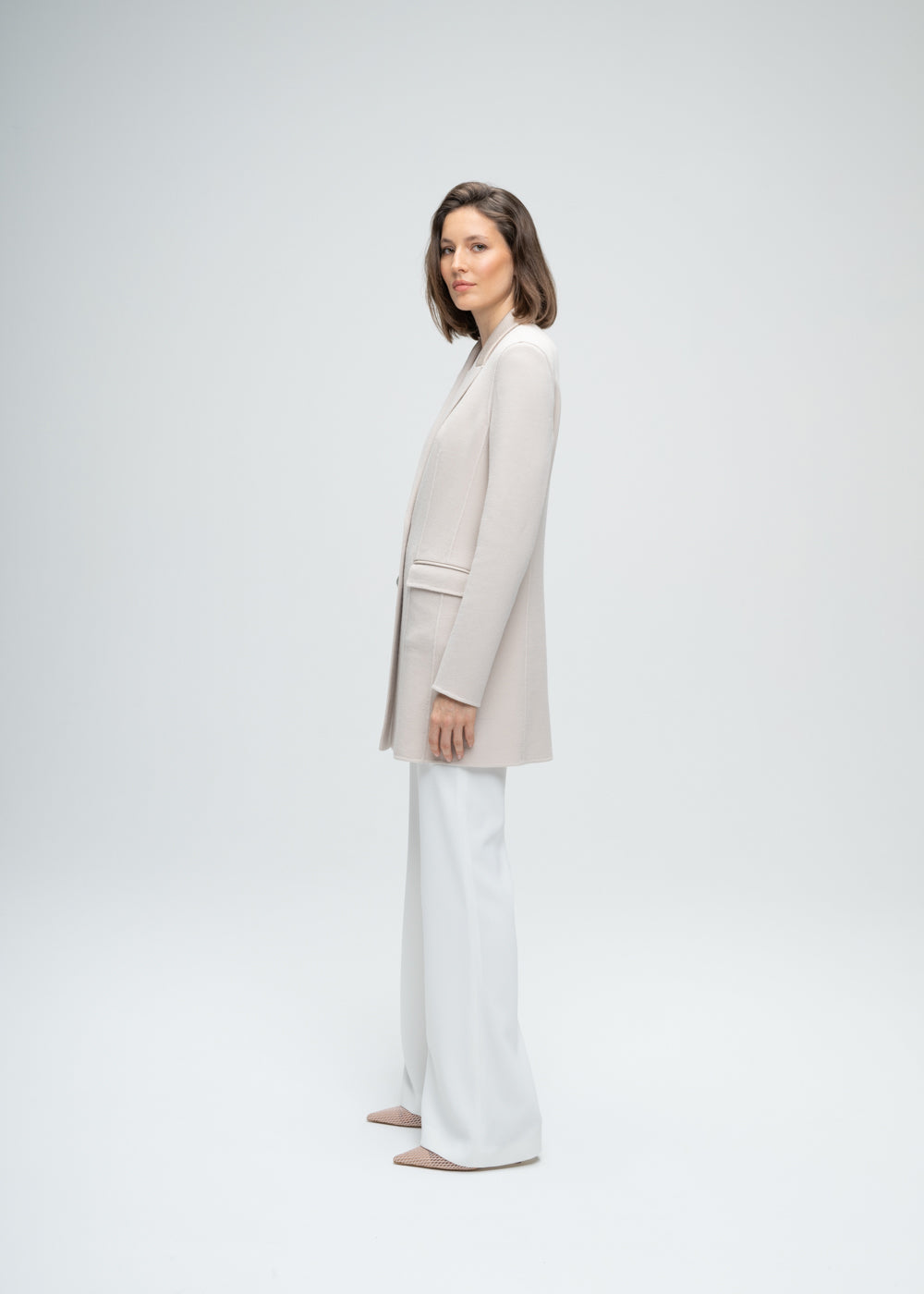 Blazer long en laine beige double boutonnière poches passepoiles en cuir