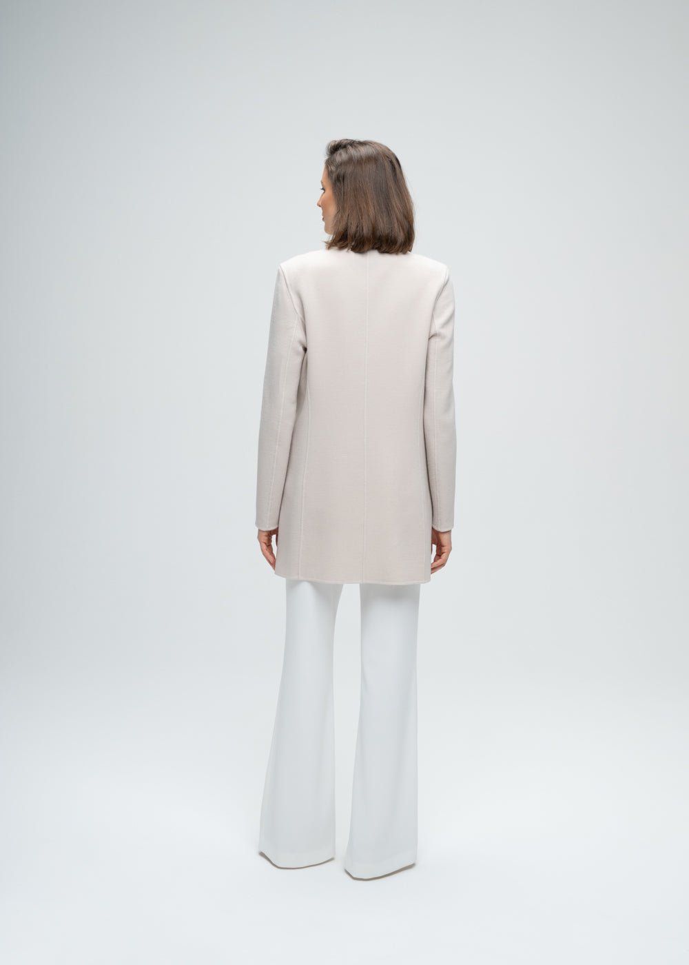 Blazer long en laine beige double boutonnière poches passepoiles en cuir