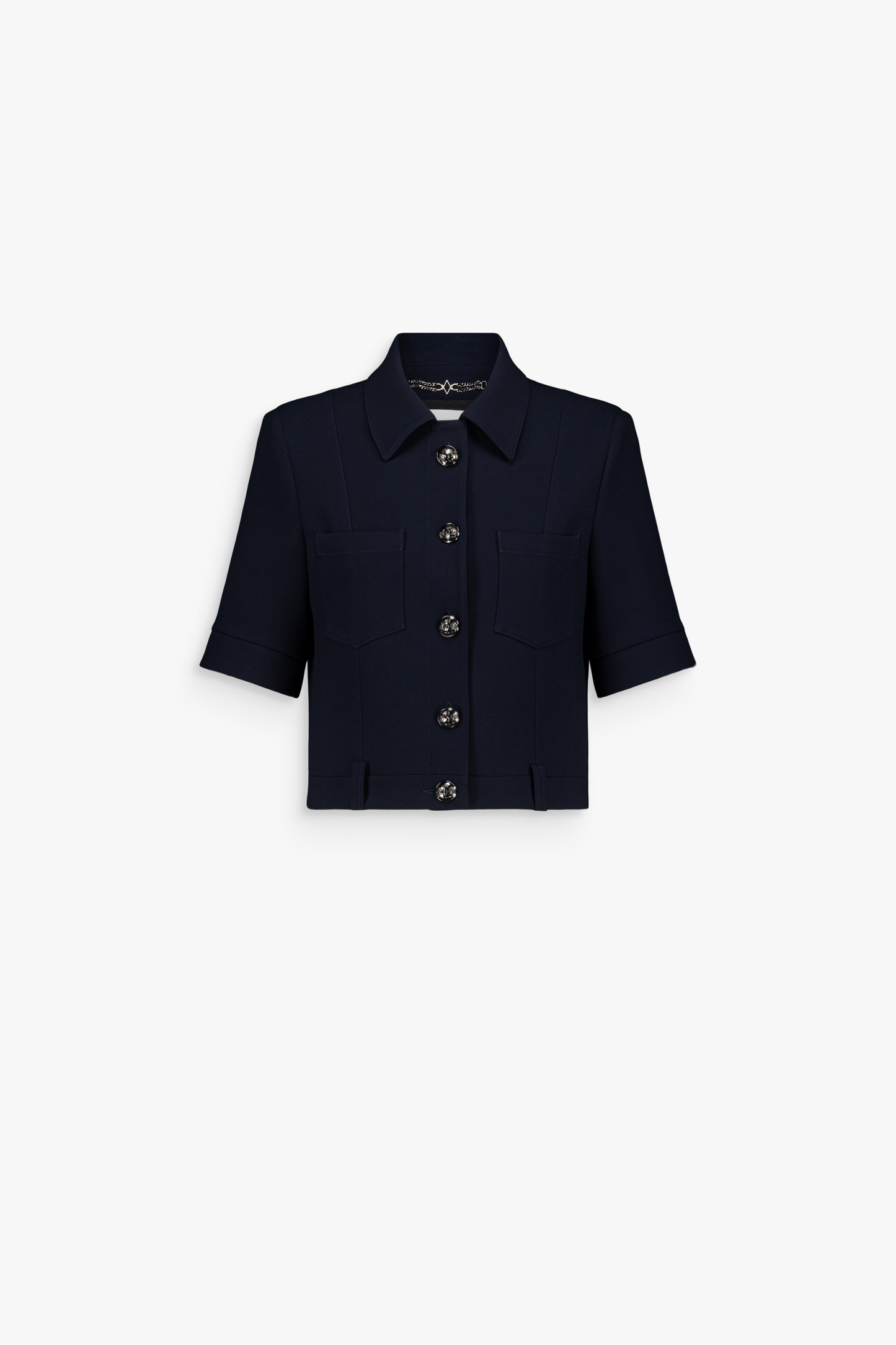 Veste courte marine à manches courtes avec col classique et boutons métalliques.