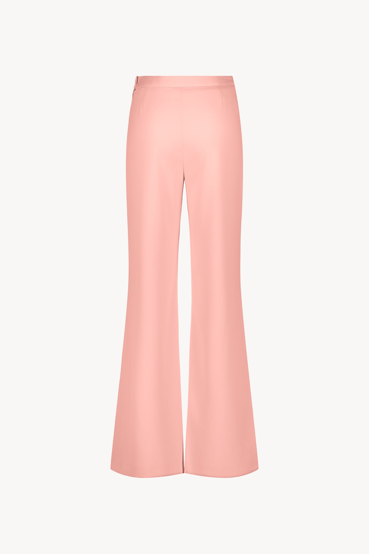 Pantalon fluide abricot à taille haute avec un zip latéral invisible.