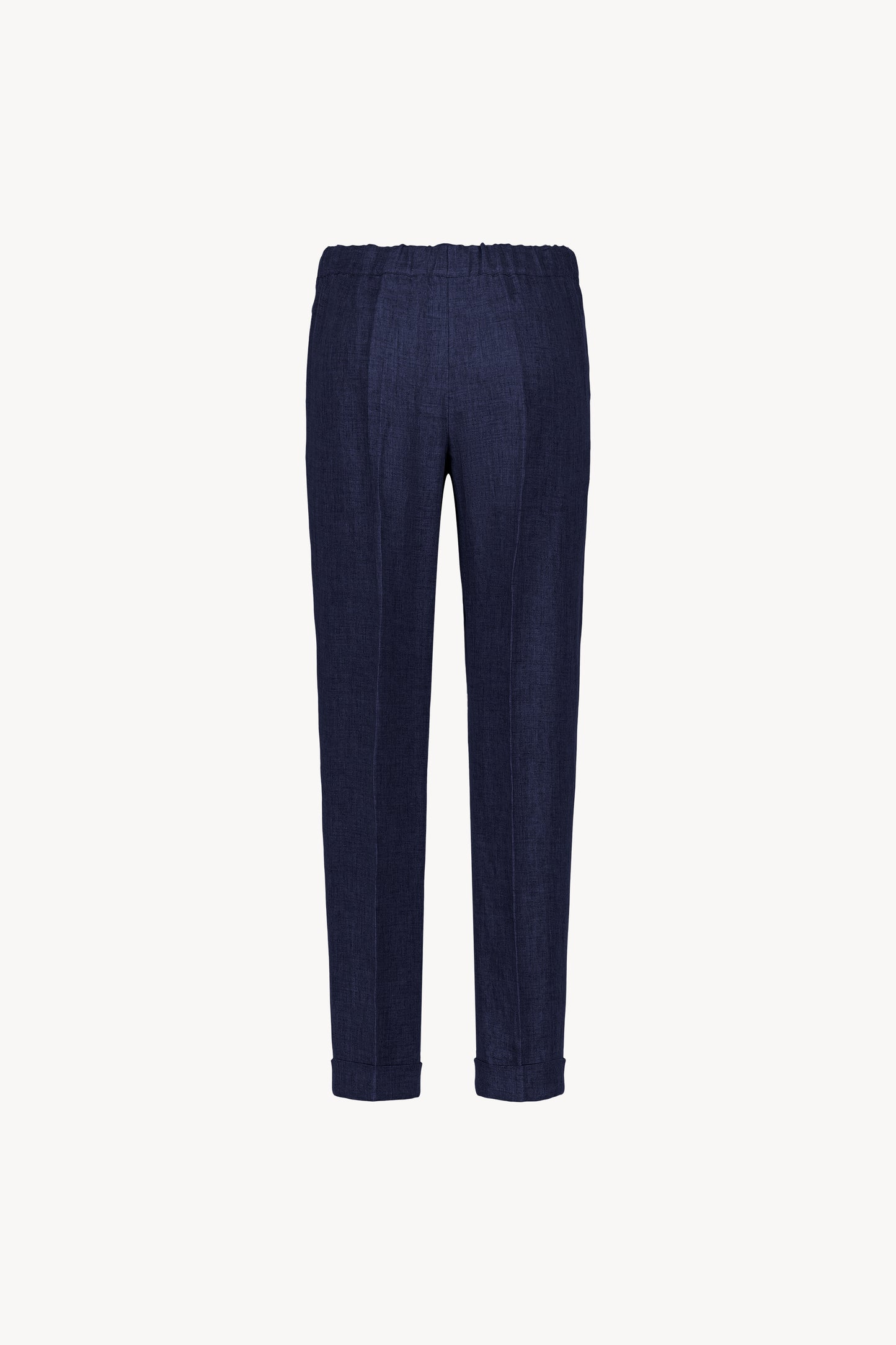 Pantalon en lin marine avec une taille légèrement froncée, plis marqués et des poches italiennes.