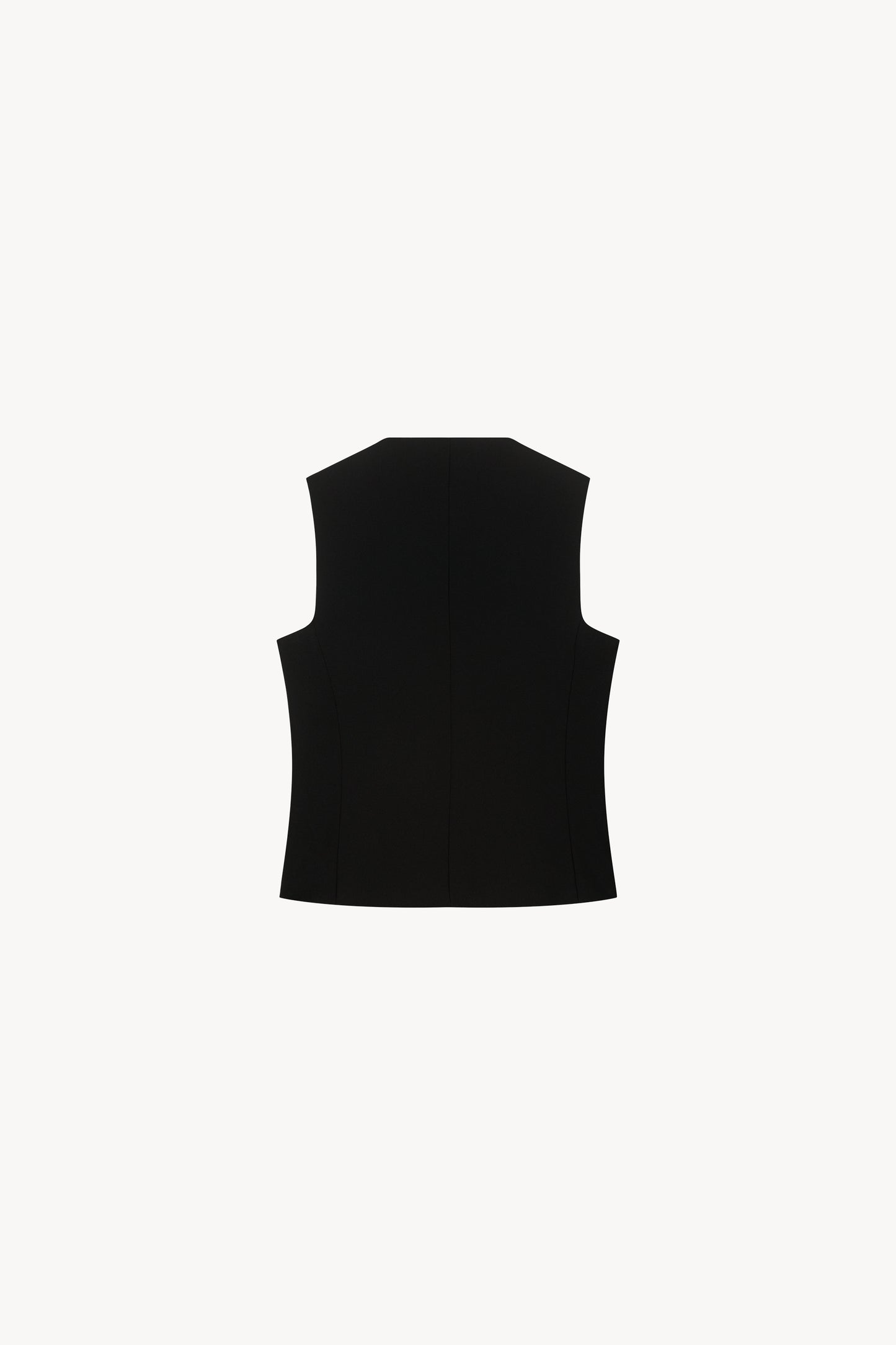 Avec sa coupe épurée et ses boutons recouverts, ce gilet noir sans manches.