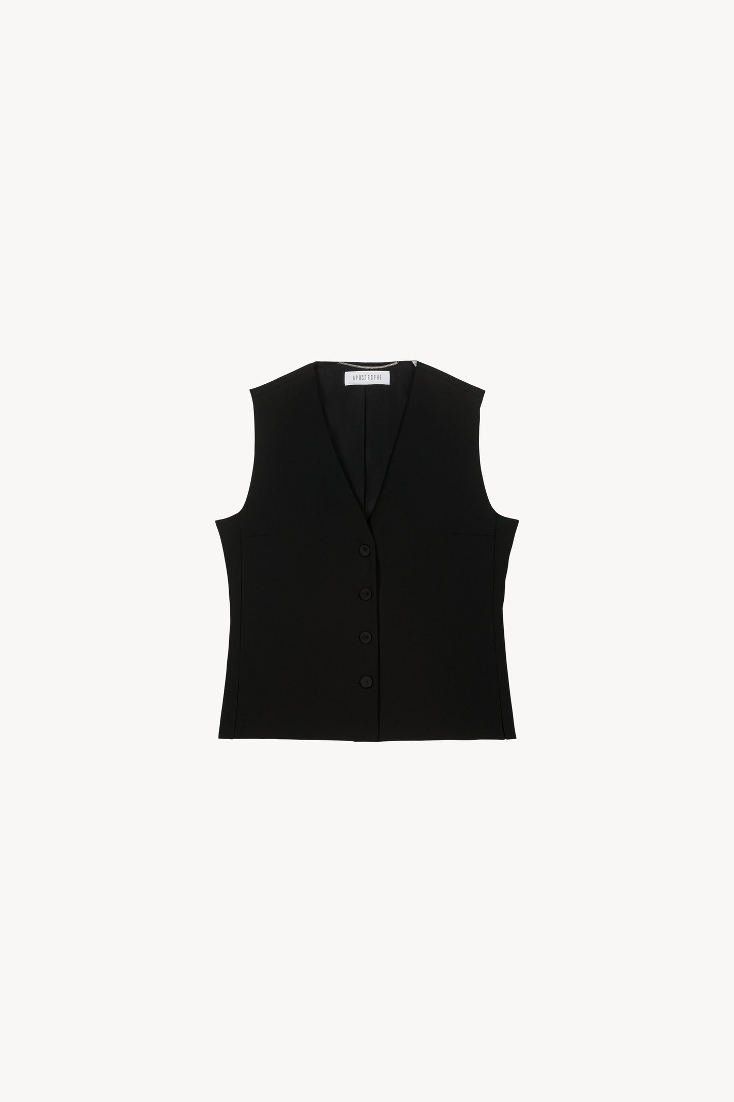 Avec sa coupe épurée et ses boutons recouverts, ce gilet noir sans manches apporte une touche discret à toutes vos tenues.