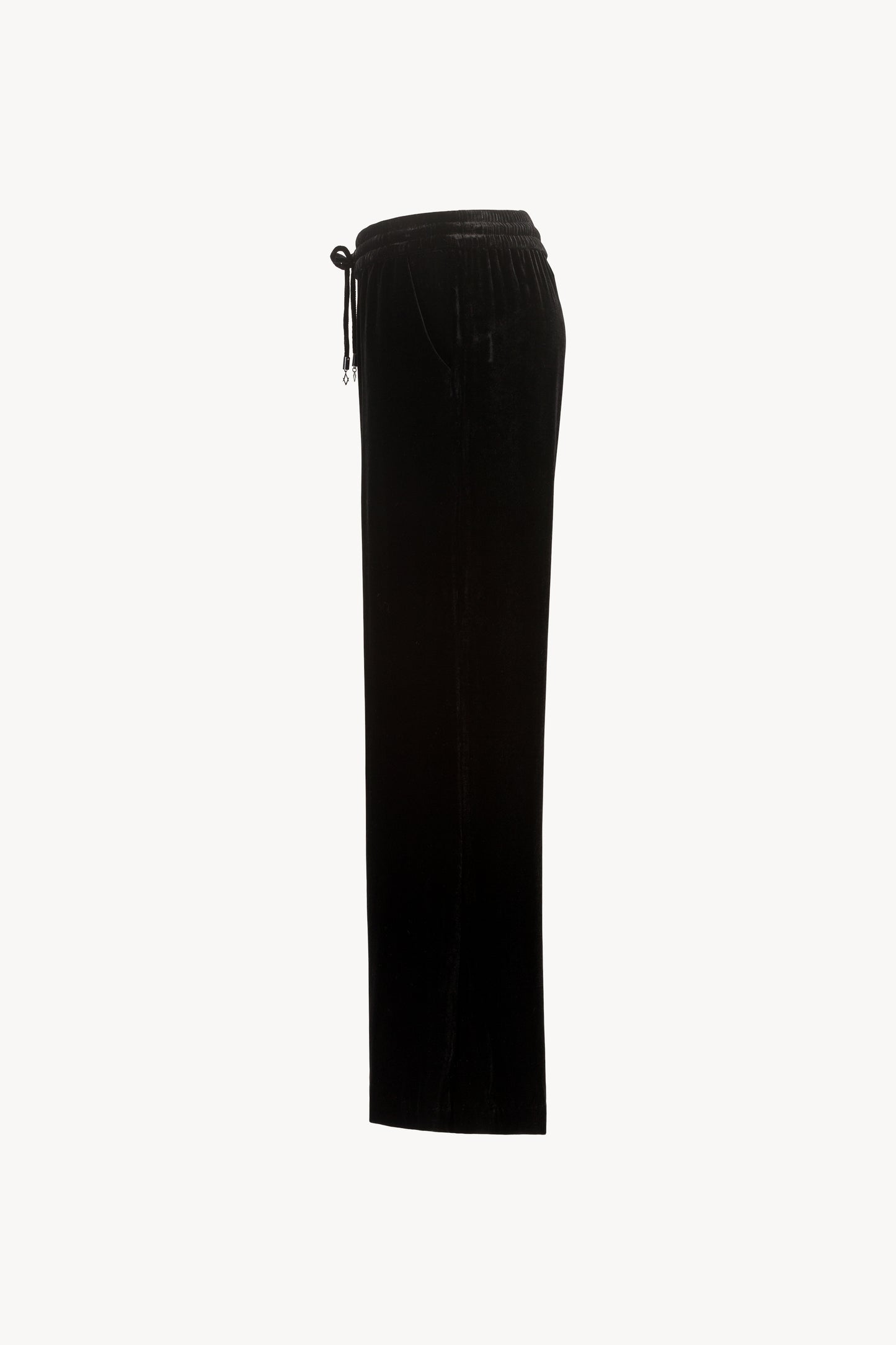 Pantalon taille haute velours noir orné d’une taille élastique avec des cordons de serrage avec les embouts bijoux iconiques Apostrophe et des poches pratiques.