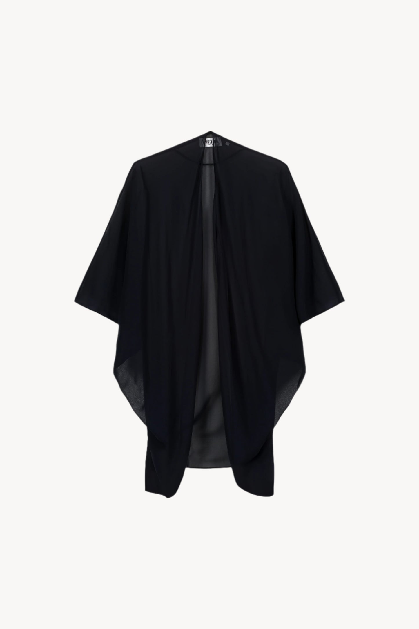 Gilet chauve-souris en mousseline de soie marine, orné d'une coupe élégante et aérienne. Transparent avec manches chauves-souris, effet froncé et bords surpiqués pour une allure chic.