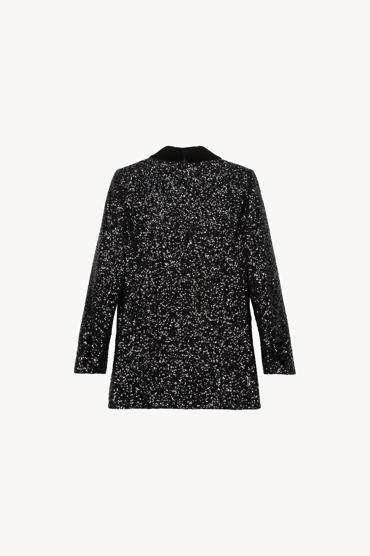 Veste fluide à sequins. Col velours. Fermeture à un bouton. Poches passepoilées.