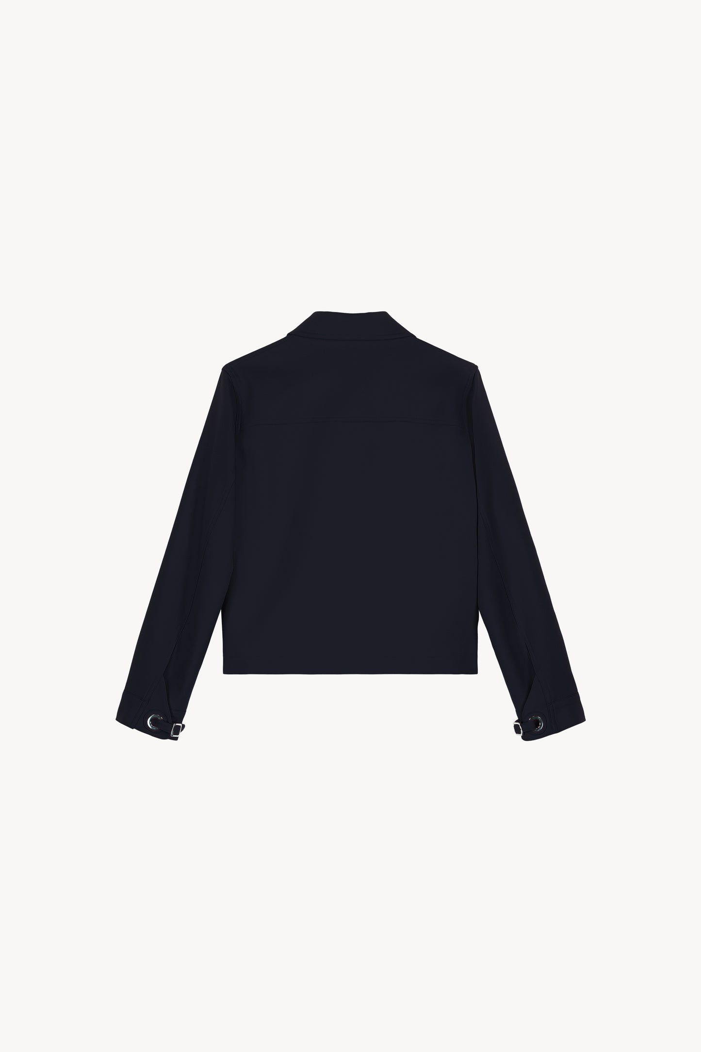 Veste courte marine coupe droite avec des détails œillets métalliques manches