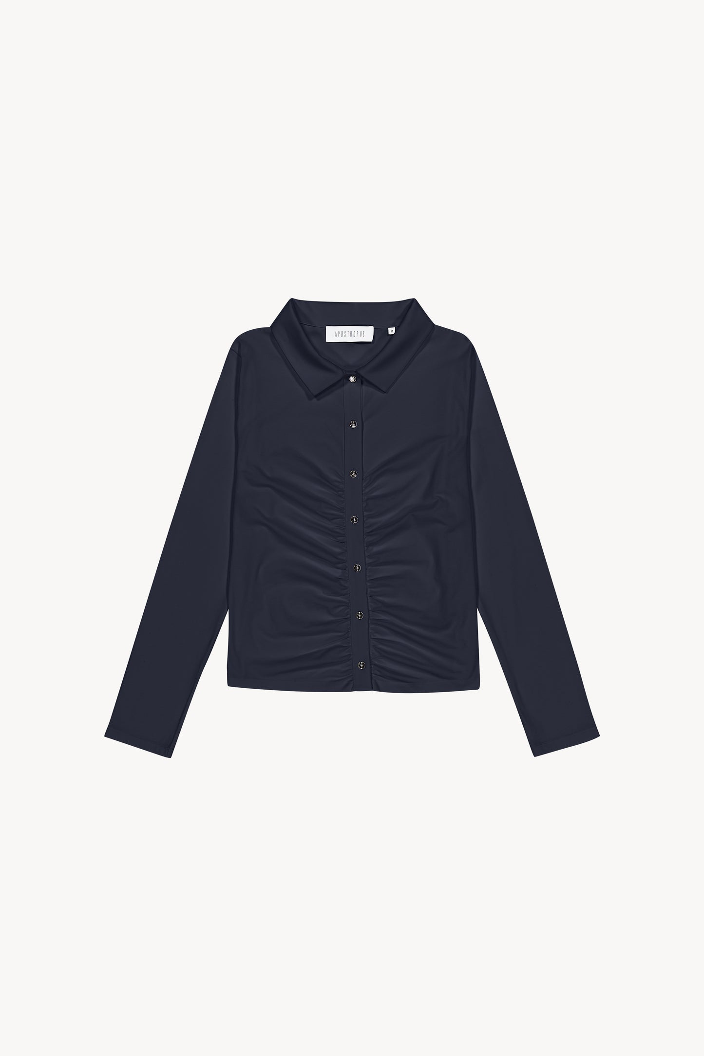 Chemise t-shirt marine dotée d'un détail froncé sur le milieu du vêtement, d'un col chemise, de patte de boutonnage apparente, de boutons métalliques et d'une pièces gravées en métal dans le dos.