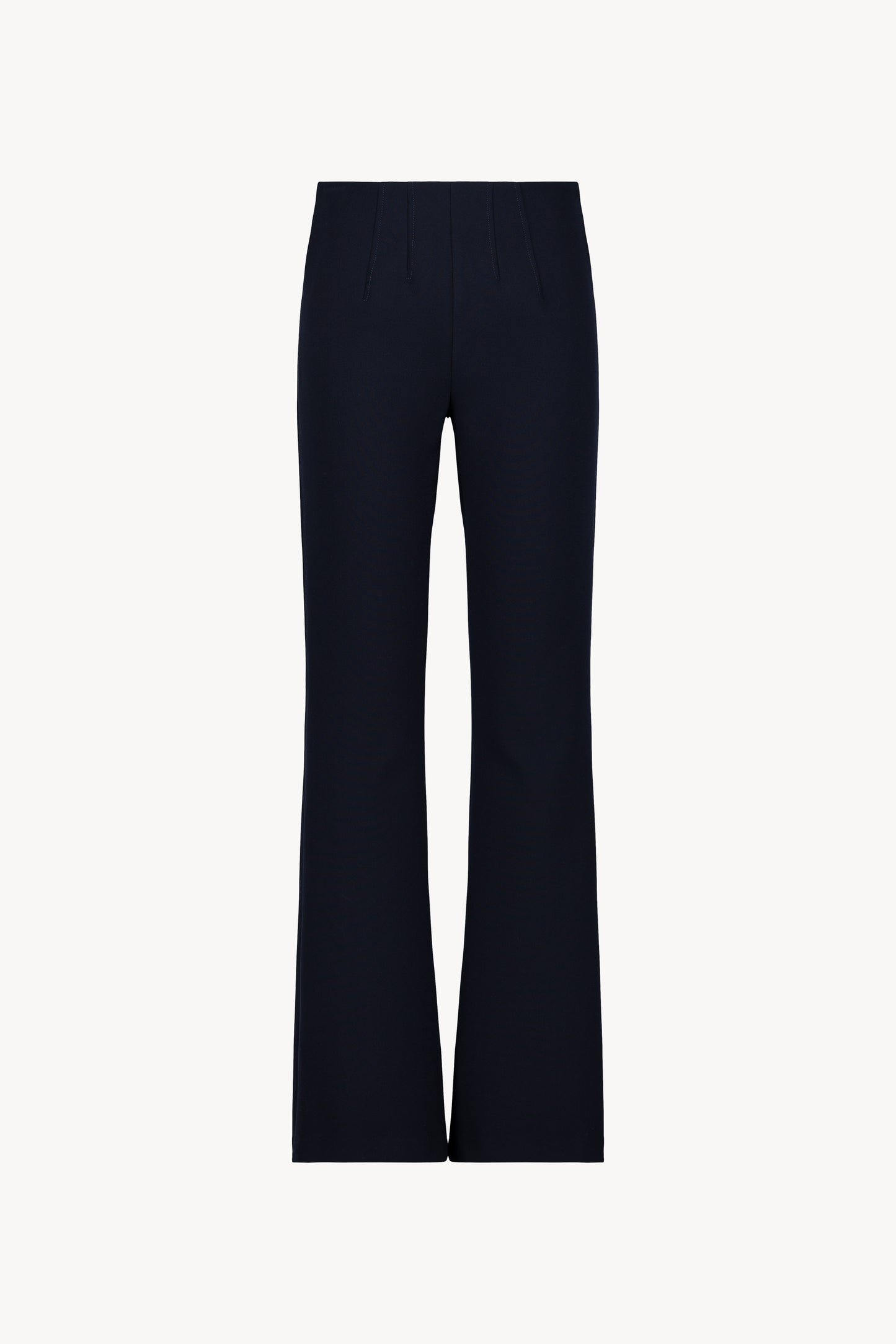 Pantalon évasé marine avec des plis délicats et une coupe fluide.