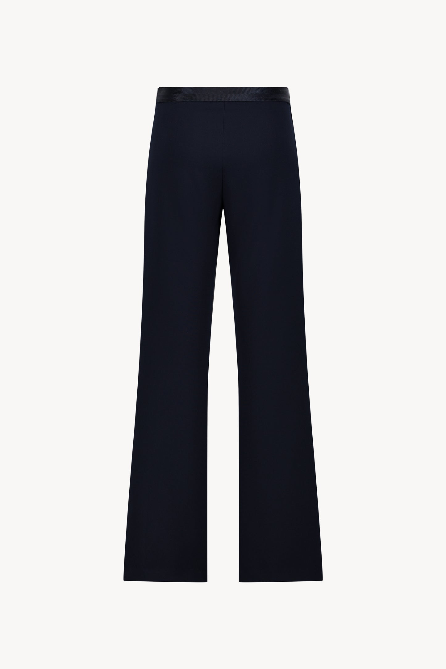Pantalon évasé marine avec des plis délicats et une coupe fluide.