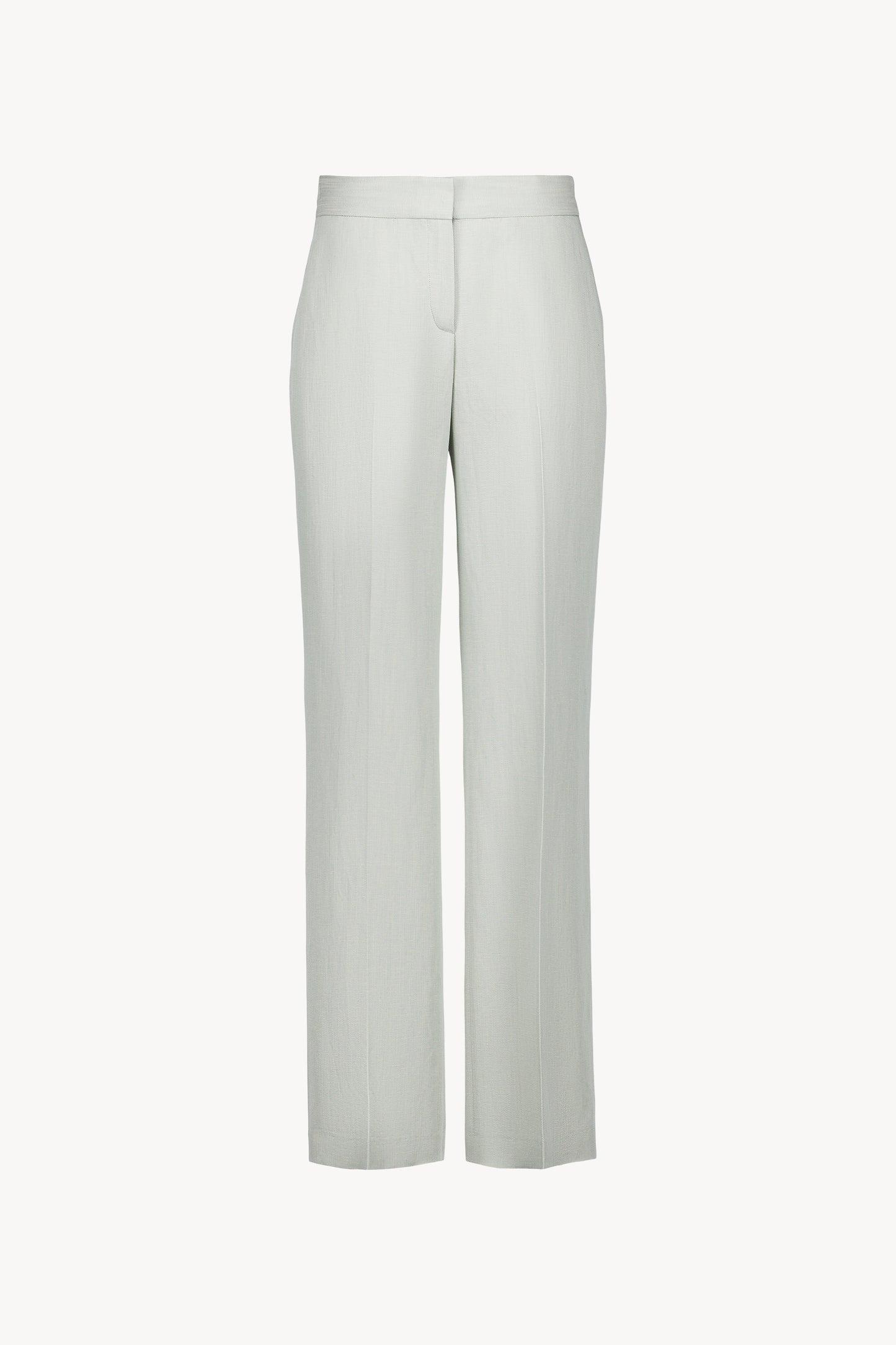 Pantalon de tailleur vert d'eau en lin naturel avec jambes droites et plis de presse marqués.