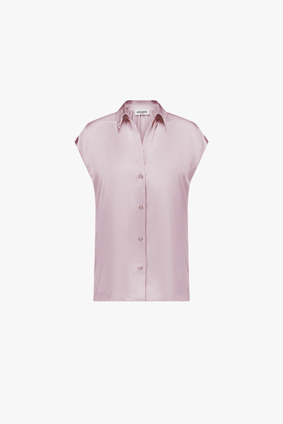 Tunique rose pale col chemise et patte de boutonnage à quatre boutons.