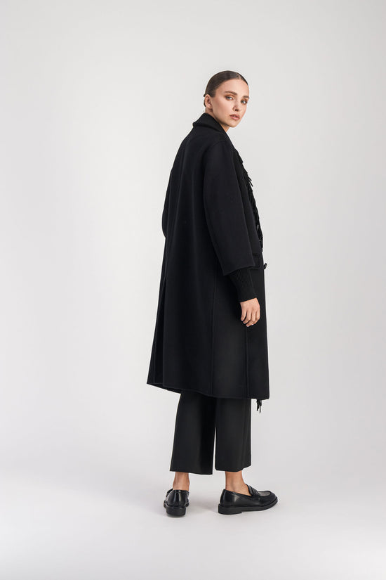 Manteau à franges noirs