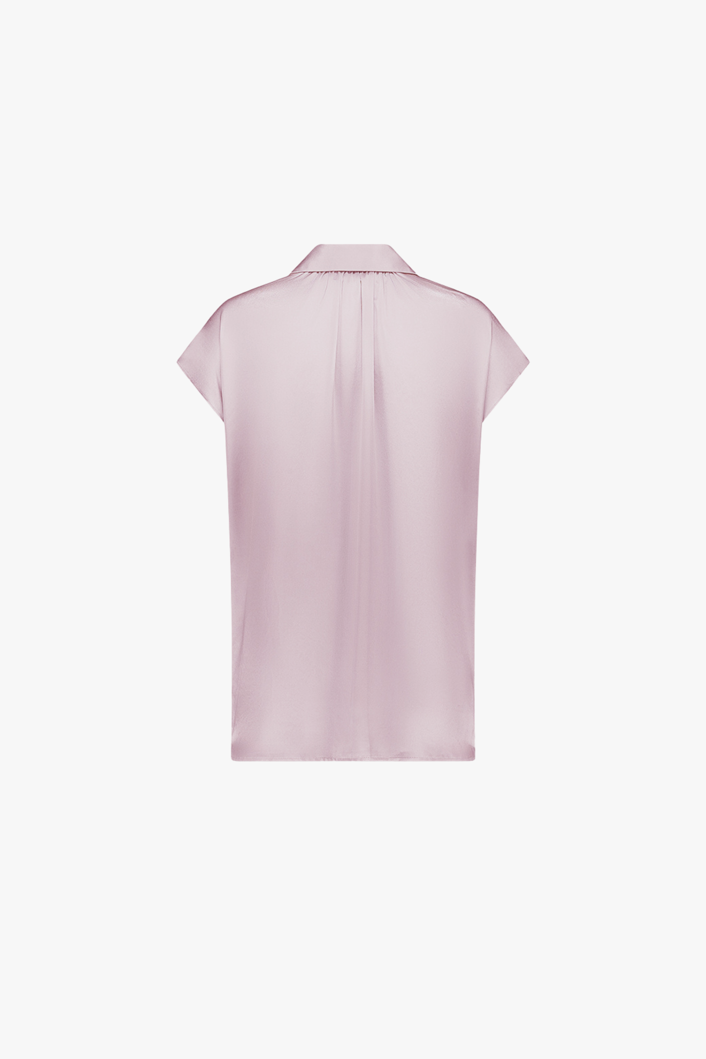 Tunique rose pale en soie, col chemise et patte de boutonnage à quatre boutons.