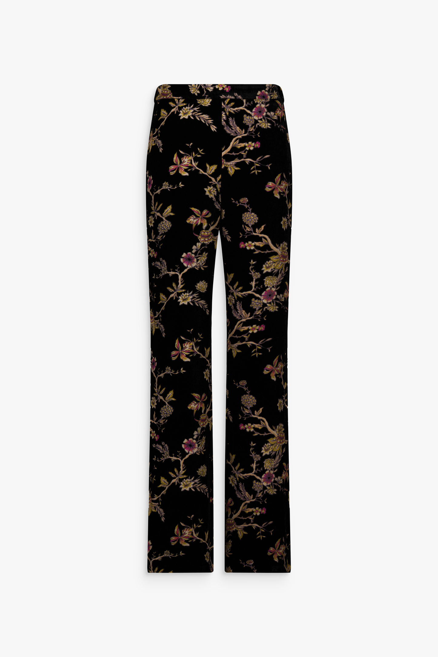 Pantalon en velours de soie noir à motifs floraux porté.