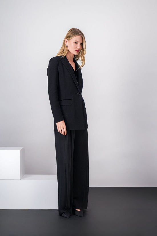 Veste noire en laine 100 %, col tailleur, coupe structurée et veston intégré