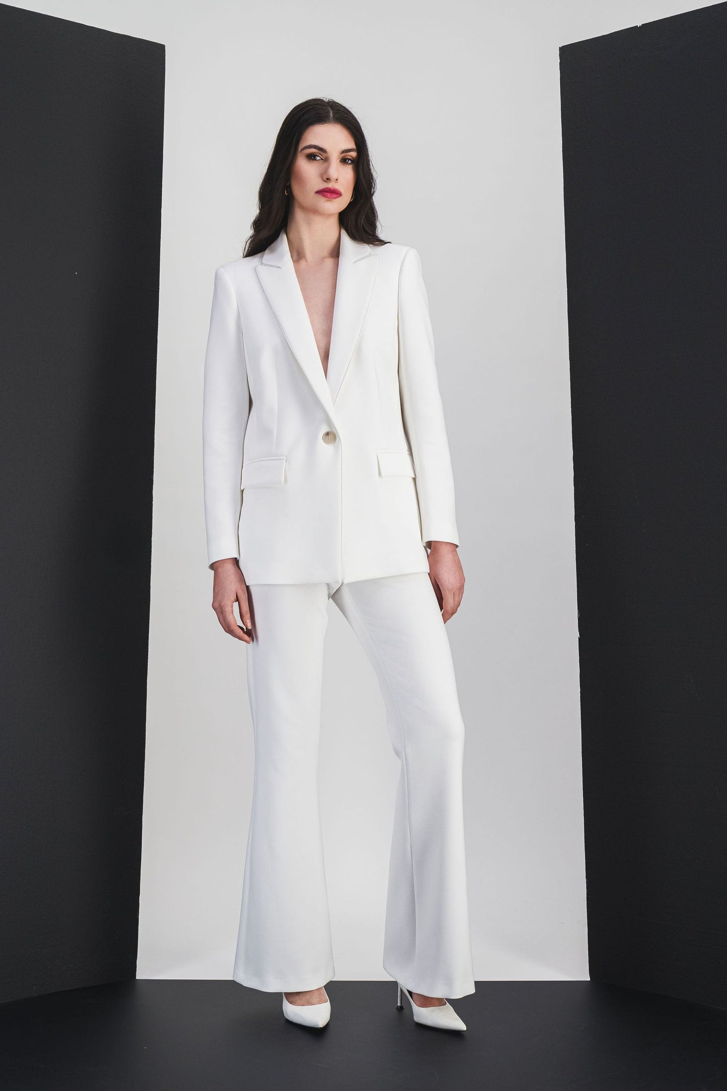 Off-white flared pants with structured pleats