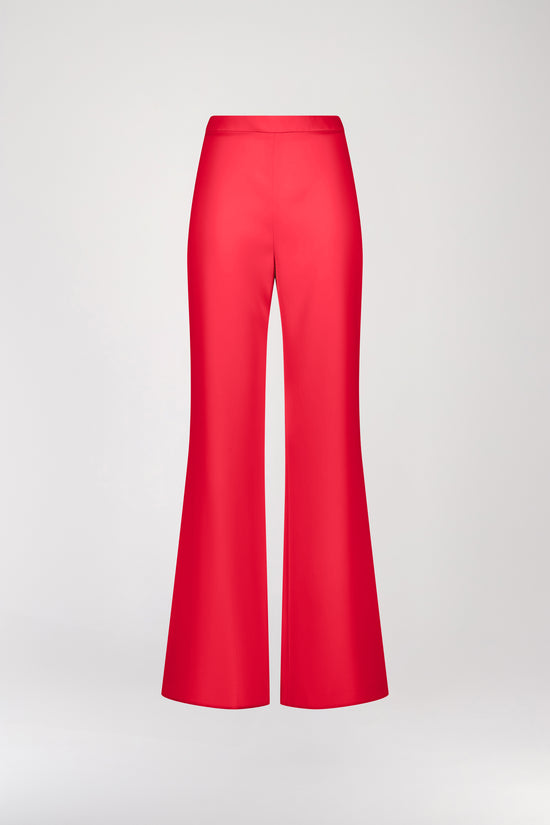 Pantalon fluide corail à taille haute, ajusté grâce à un zip latéral invisible. Les fines surpiqûres apportent une touche sophistiquée, tandis que le tissu léger offre un confort inégalé au quotidien.