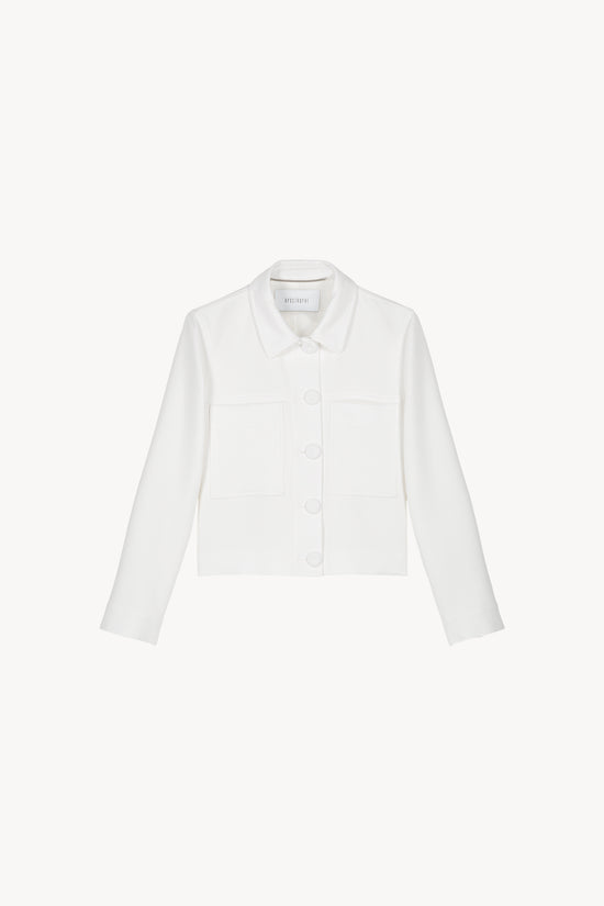 Veste blazer courte blanche, avec une coupe droite et un col tailleur . 