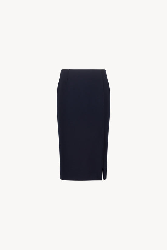 Jupe droite bleu marine longueur genou, fente côté et pinces à la taille.