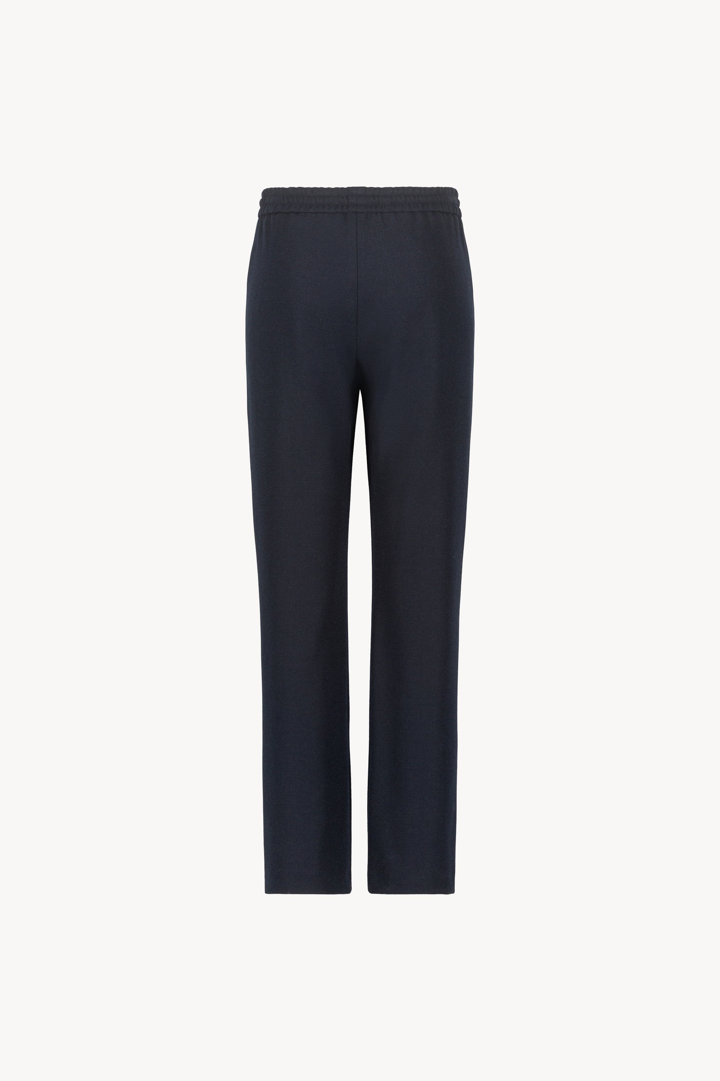 Pantalon marine orné d'une coupe décontractée, avec des jambes fluides et une taille élastique dotée d'un cordon de serrage sur le devant.