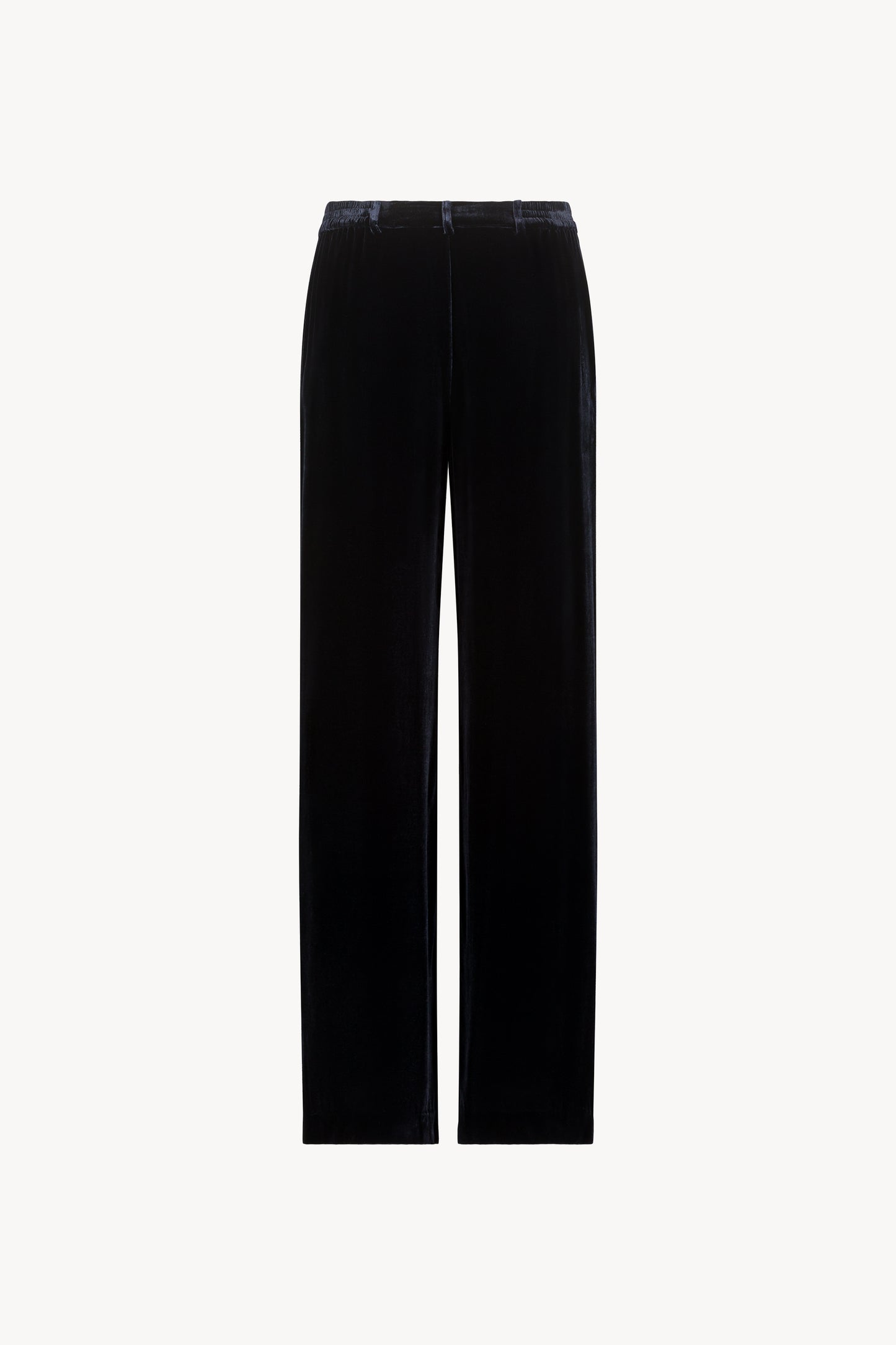 Ce pantalon en velours de soie bleu marine à taille élastique et plis frontaux est la touche sophistiquée.