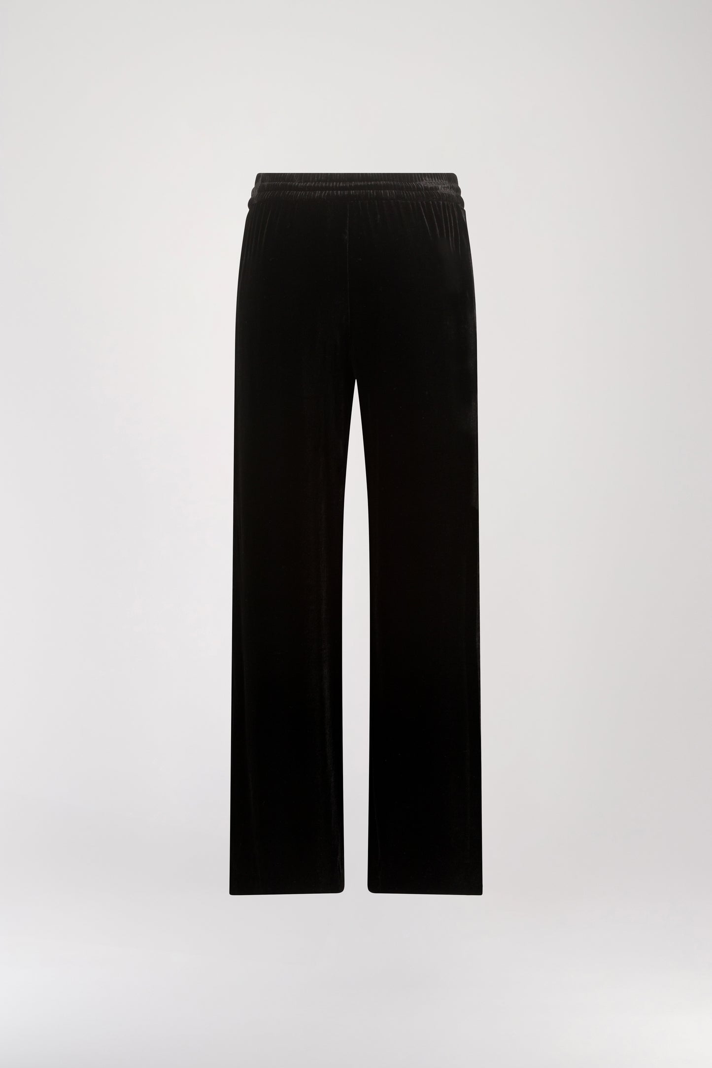 Pantalon taille haute velours noir orné d’une taille élastique avec des cordons de serrage avec les embouts bijoux iconiques Apostrophe et des poches pratiques.