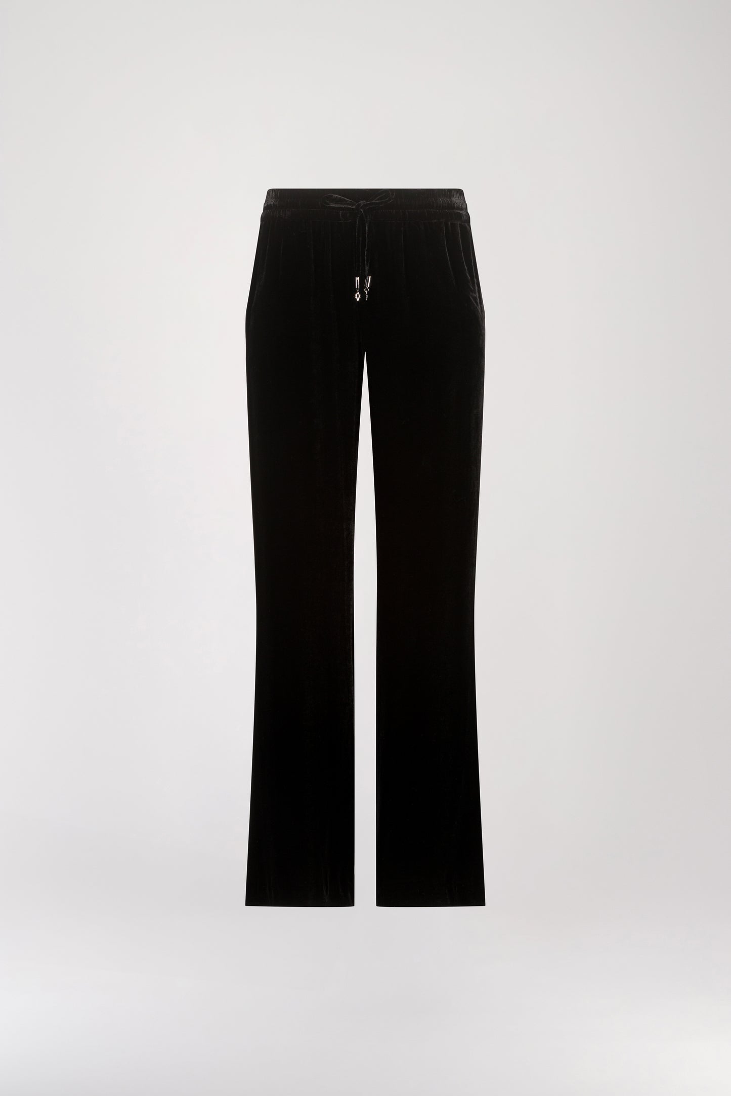 Pantalon taille haute velours noir orné d’une taille élastique avec des cordons de serrage avec les embouts bijoux iconiques Apostrophe et des poches pratiques.