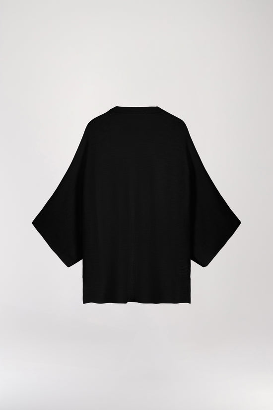 Black poncho sweater