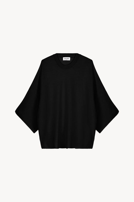 Chemise fluide à imprimé fleuri bleu avec manches retroussables et boutons nacrés.