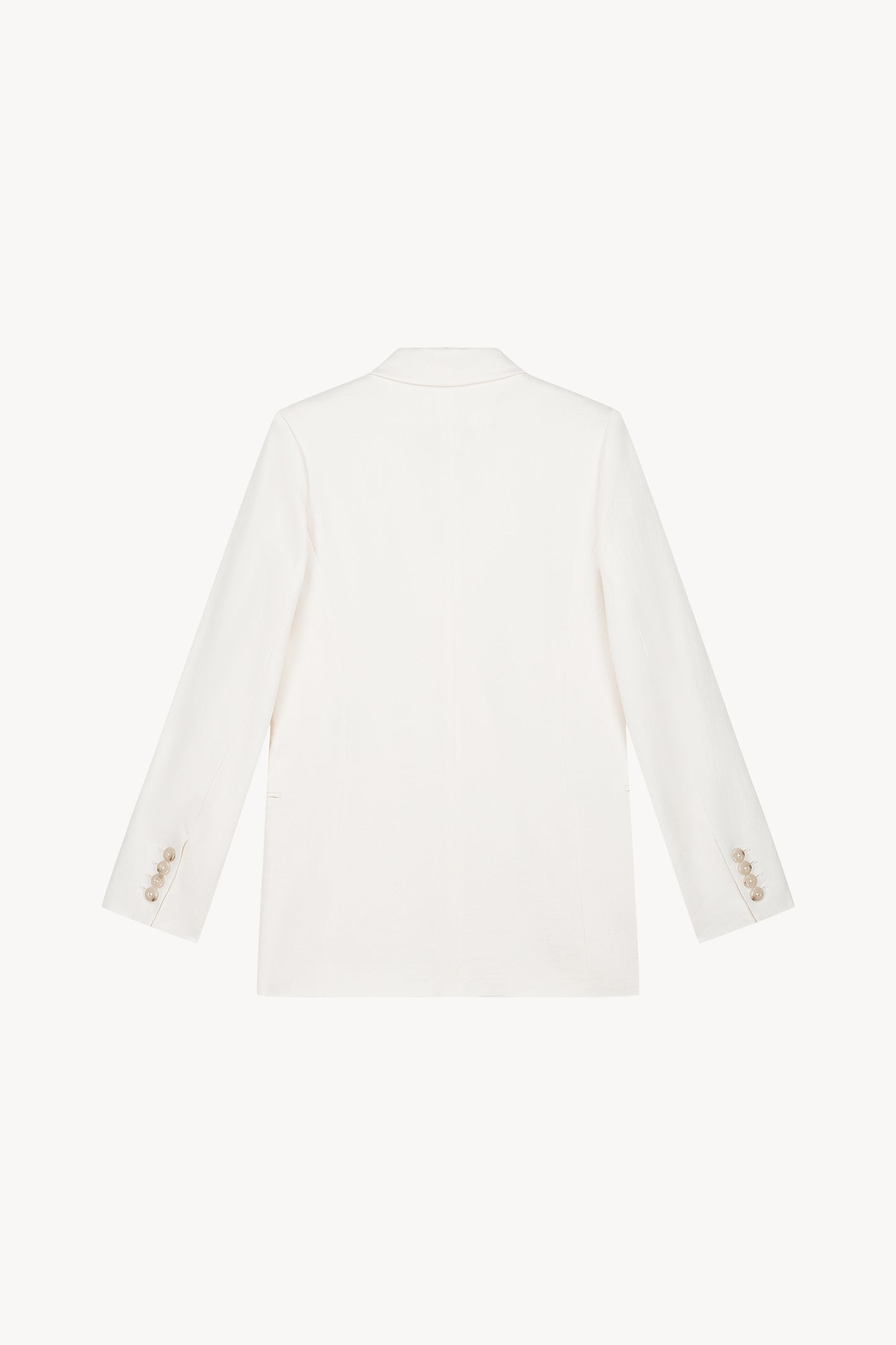 Veste blanche en lin, élégante et pratique avec des boutons ton sur ton et une coupe moderne.