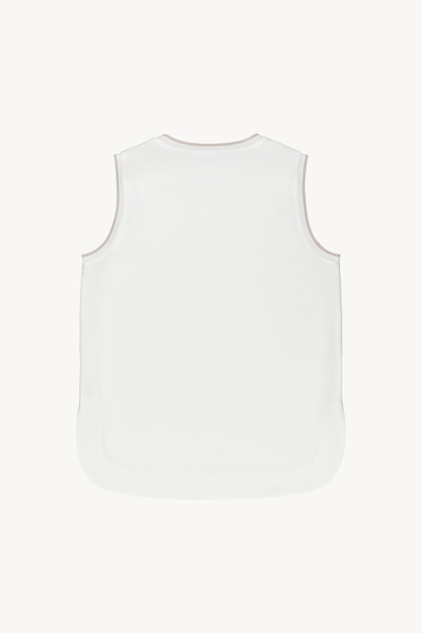 Ce haut blanc fluide et doux offre une coupe droite et des finitions côtelées.
