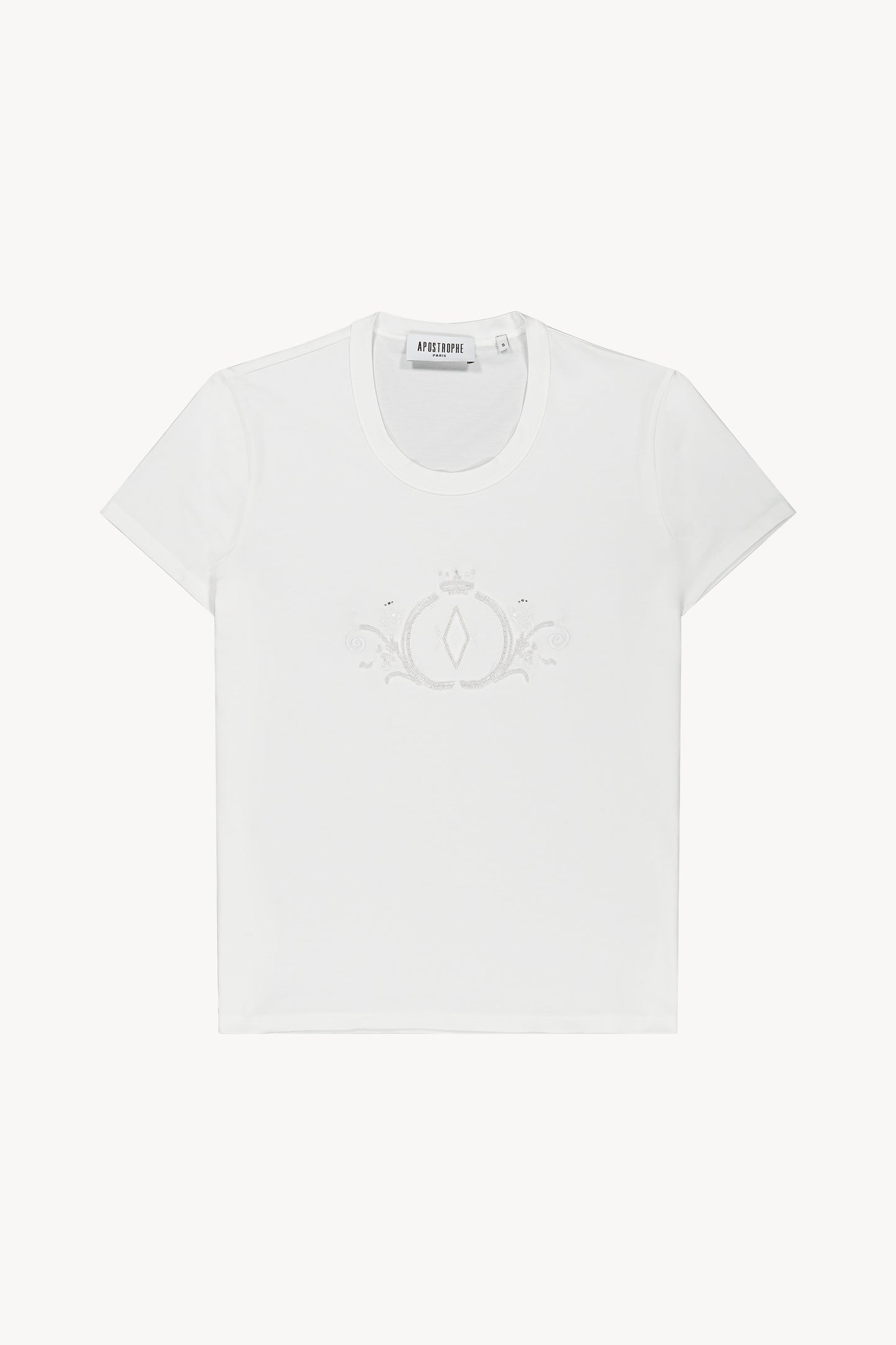 T-shirt blanc optique en jersey de coton, col rond, manches courtes, broderie délicate de perles sur le devant.