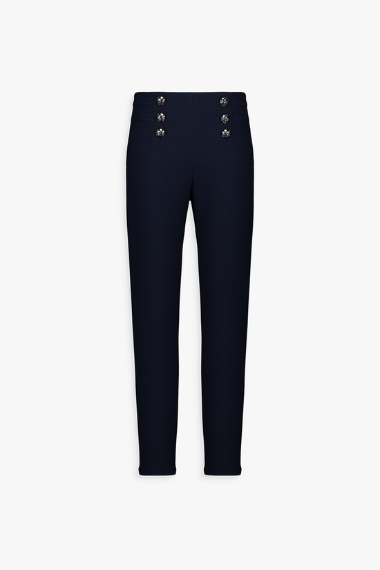 Pantalon droit marine, boutons argentés floraux et ceinture élastique subtile.