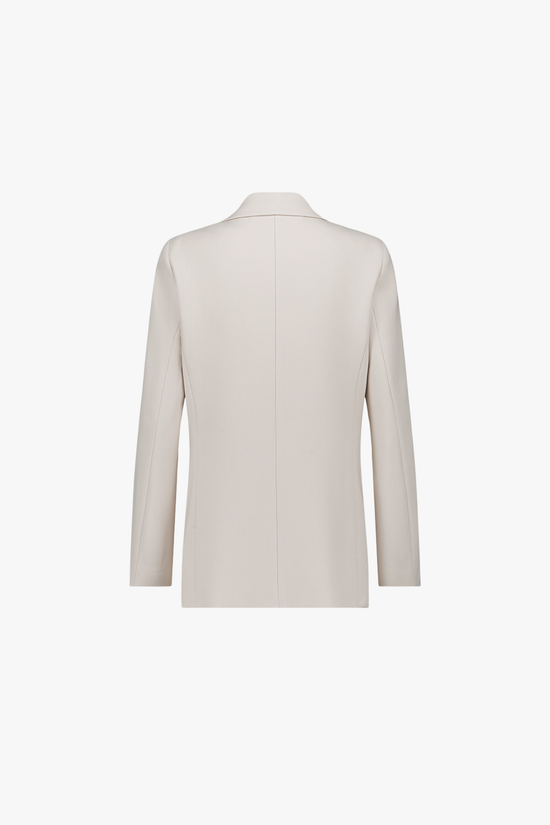 Dos de la veste ajustée ton béton, coupe structurée et ligne épurée.