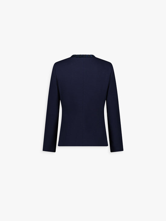 Dos de la veste marine, coupe droite et ligne structurée.