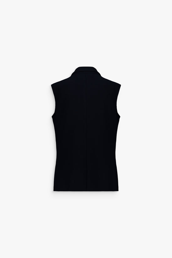 Gilet à revers en pointe, tissu de qualité et allure chic et structurée.