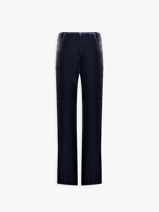 Dos du pantalon velours marine, coupe longue et tombé élégant.