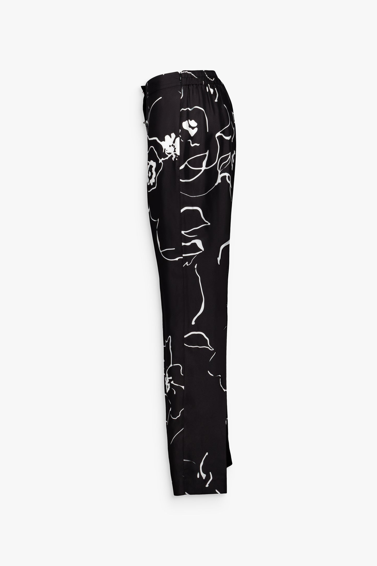 Pantalon femme noir, fluidité et sophistication avec boutons bijoux.