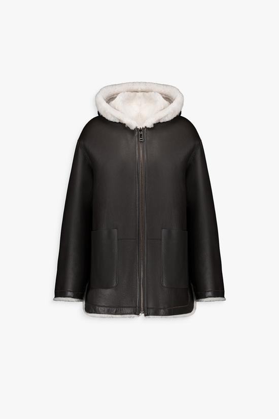 Manteau court en cuir, coupe droite classique avec fermeture éclair et cordons de serrage discrets.