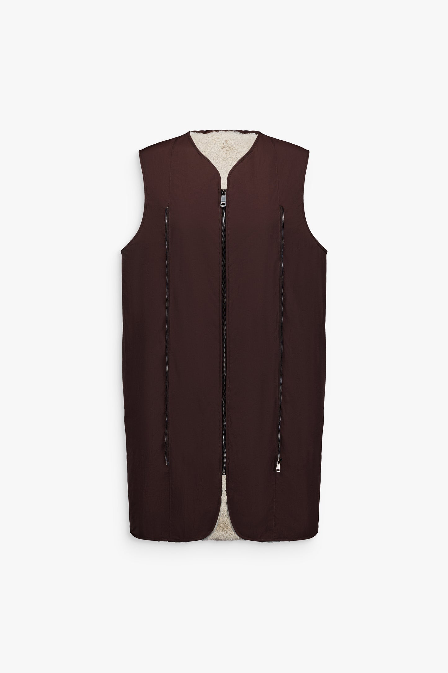 Fourrure marron réversible avec gilet intérieur amovible, col raglan et zip caché.