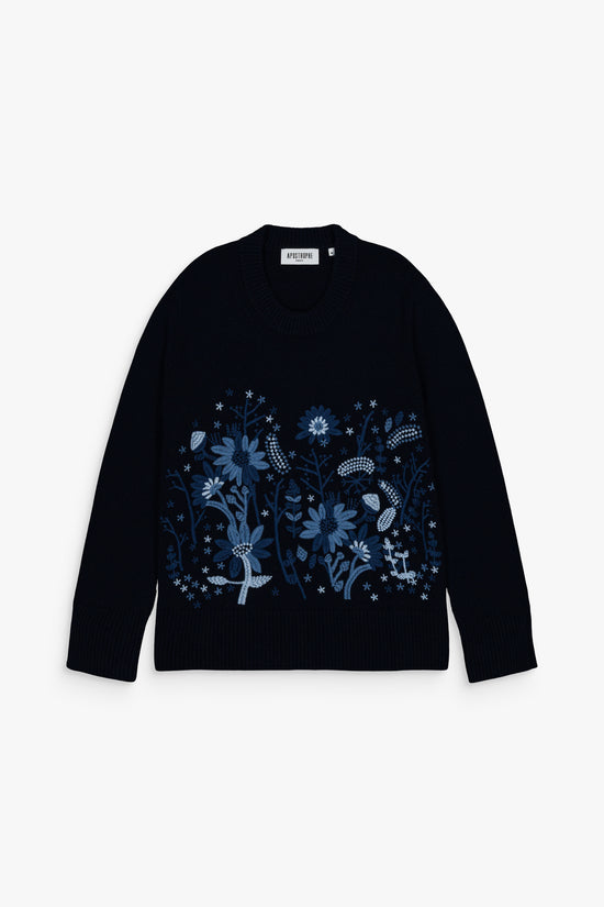 Pull droit en laine et cachemire, couleur marine, finitions côtelées et broderies délicates.