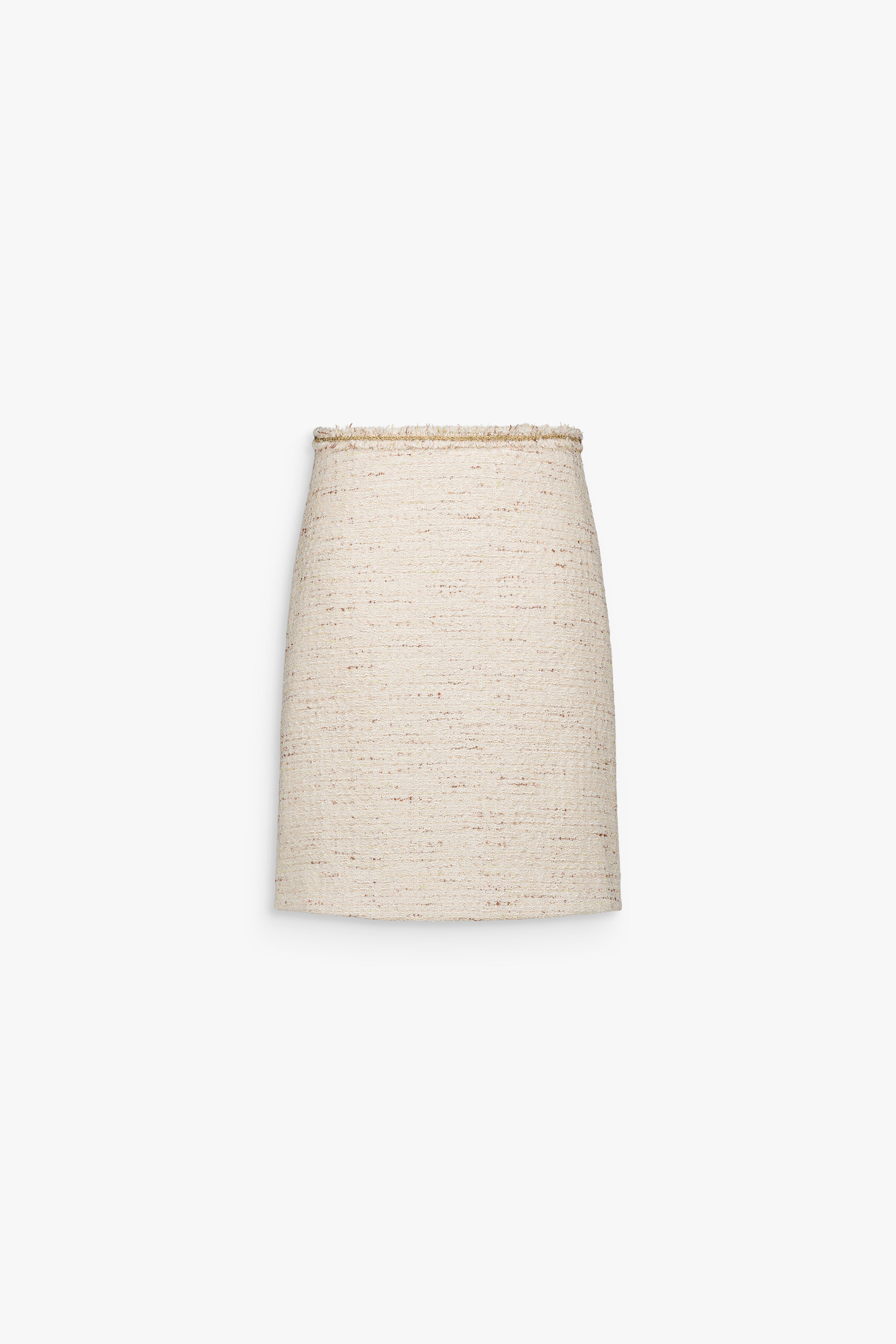 Jupe crayon en tweed jaune clair à coupe ajustée et texture texturée.