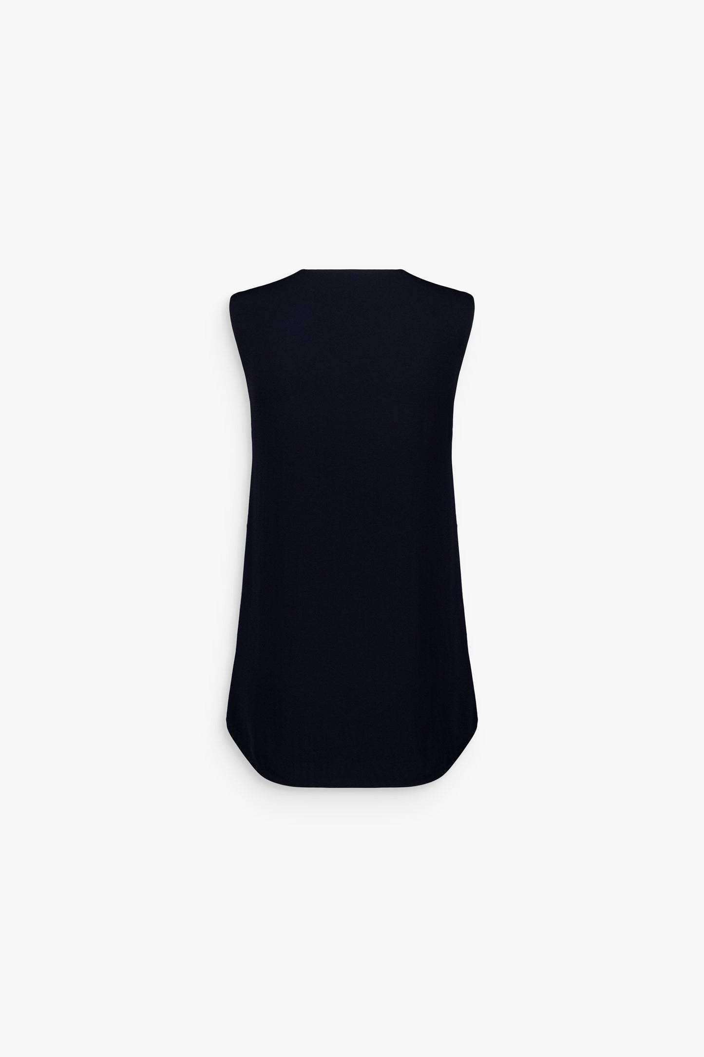 Top bleu marine à encolure en V et coupe fluide moderne.