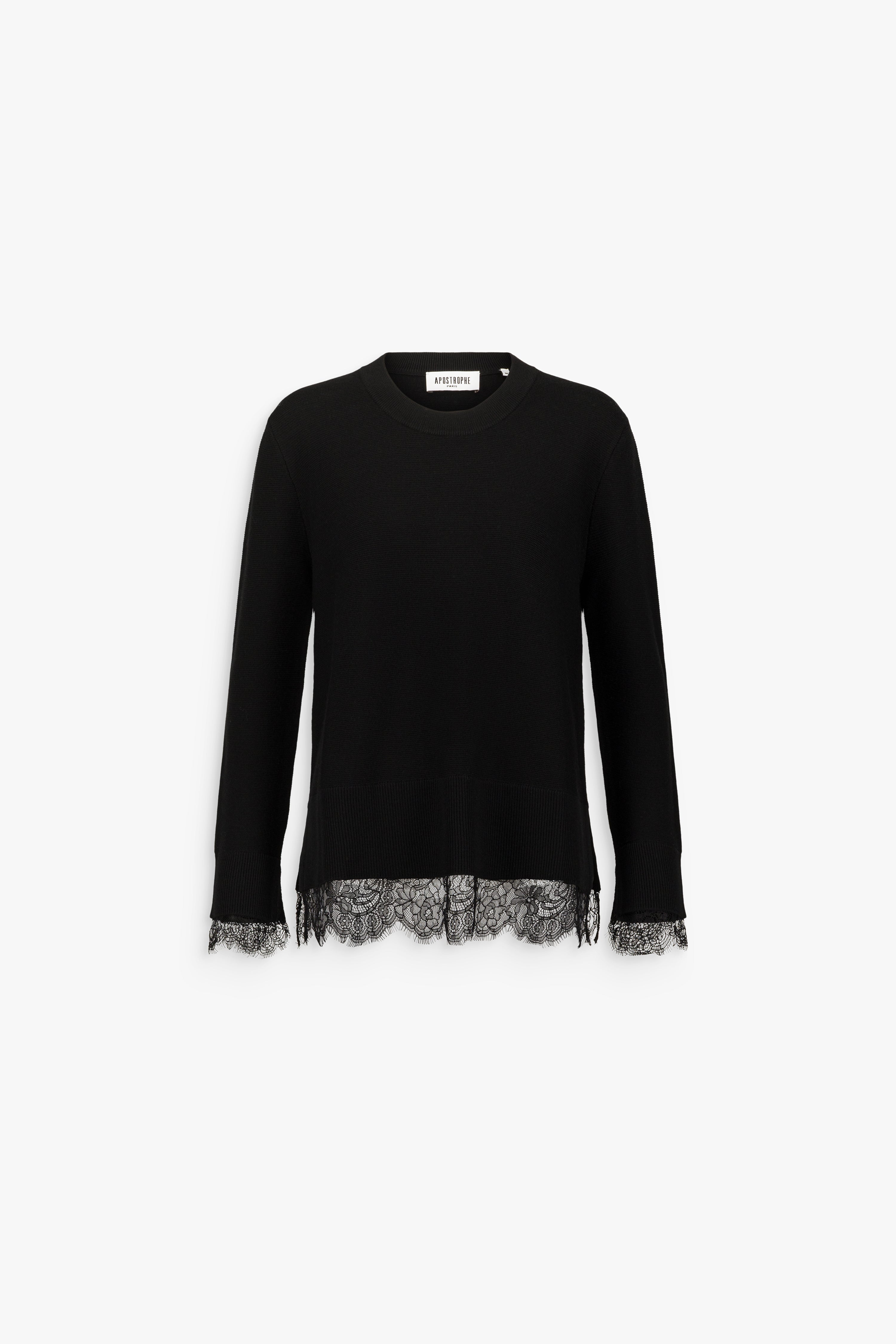 Pull long noir en laine mérinos, à col rond, manches longues et détails en dentelle au bas et aux poignets.