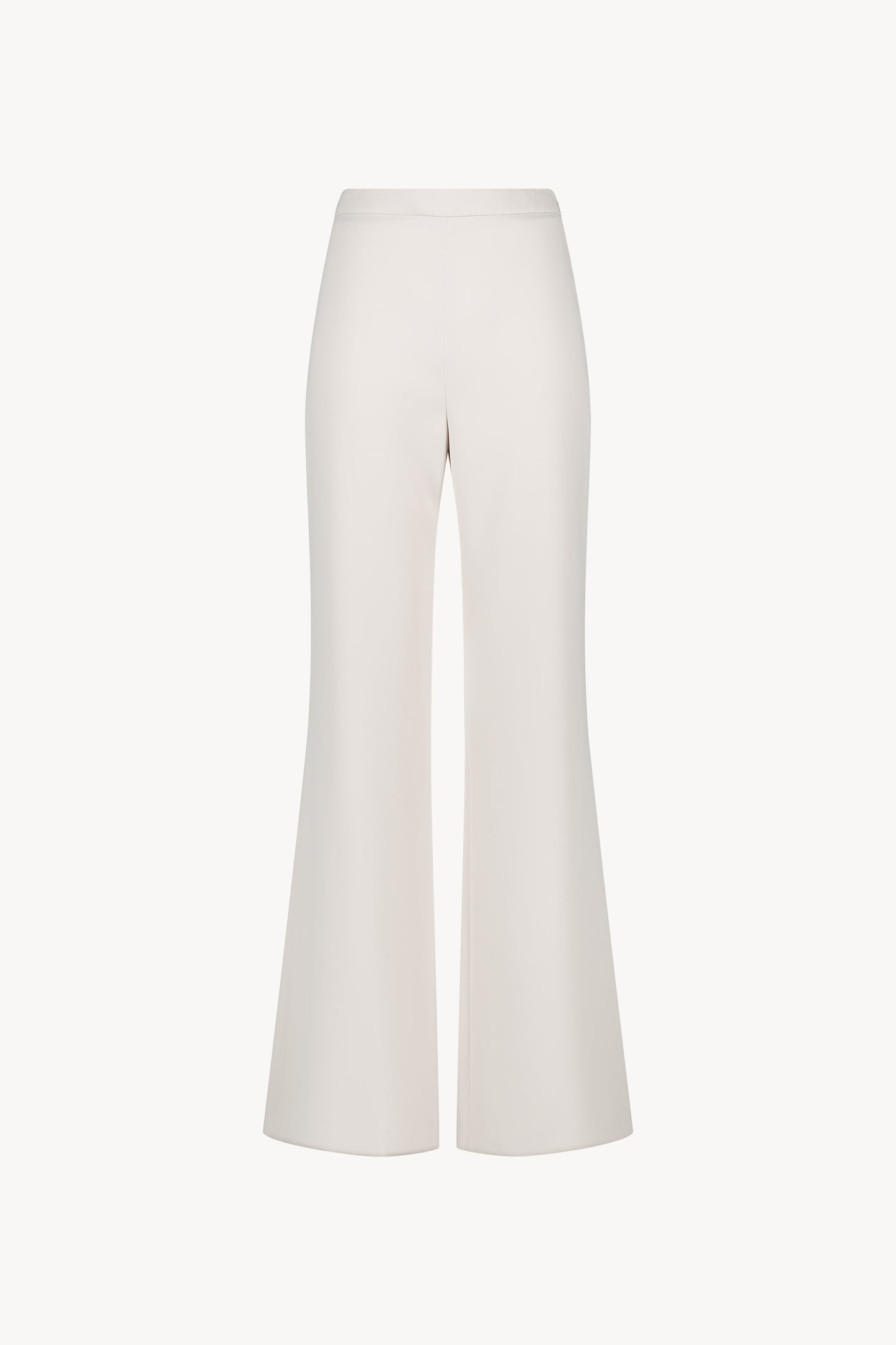 Pantalon évasé. Sa coupe flatteuse et son zip invisible côté ajoutent une touche de sophistication.