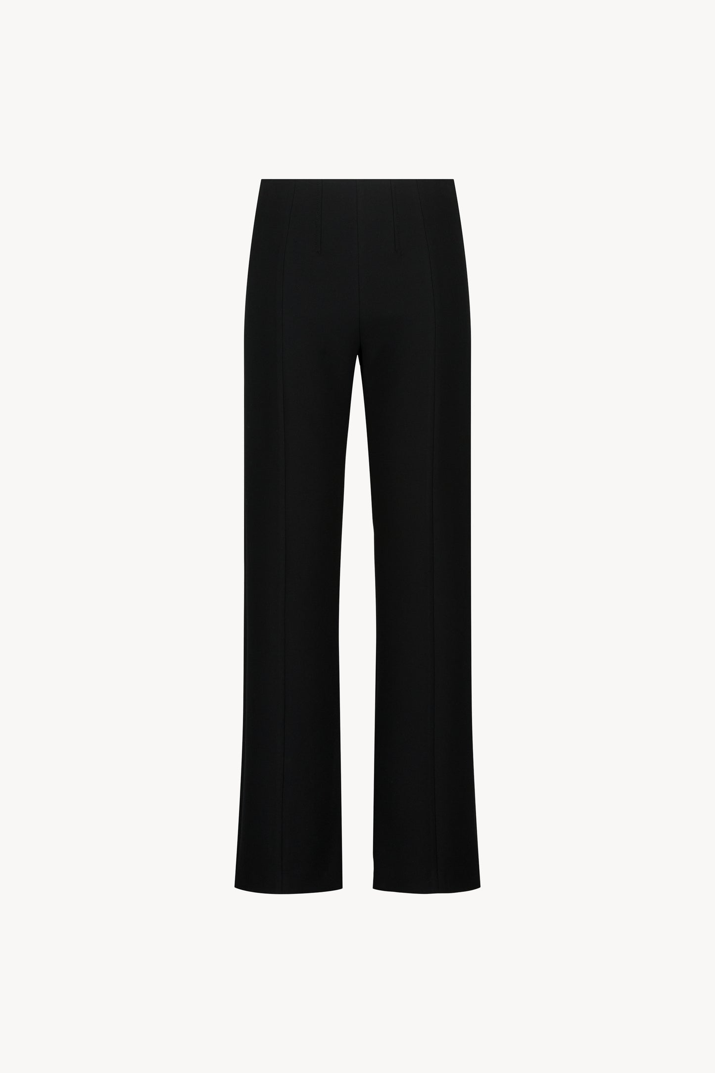 Pantalon ajusté noir avec taille élastique et fentes italiennes, alliant confort et élégance intemporelle.
