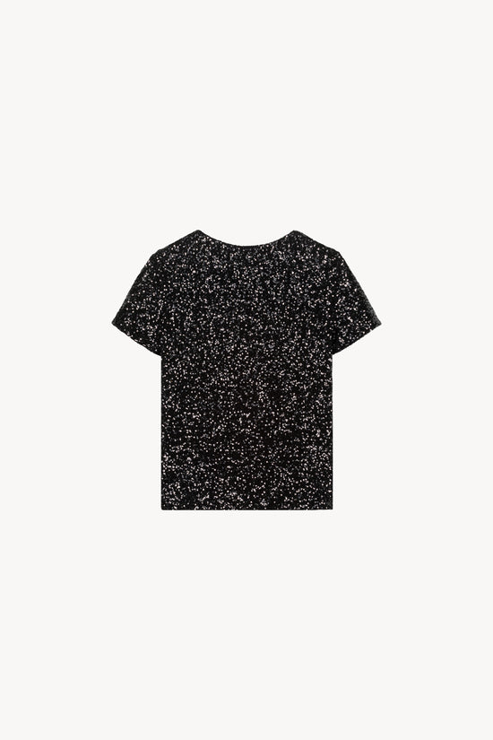 Col rond et manches courtes. Orné de sequins noirs 